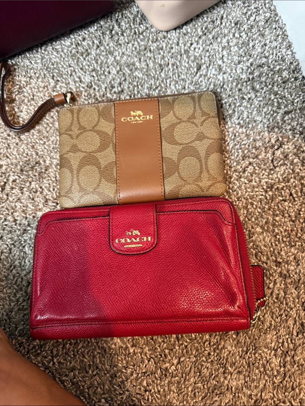 Two coach wristlets